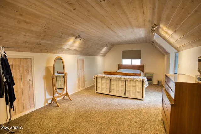 a bedroom with bunk beds and a chandelier