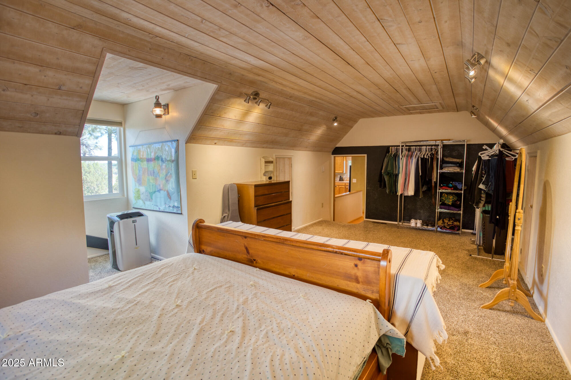 2611 Ellsworth Avenue Show Low, AZ 85901 - Photo 18 of 41 a large bedroom with bed and wooden floor