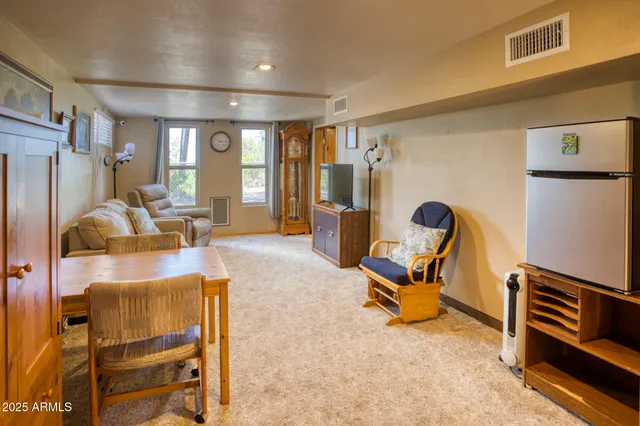 a view of a livingroom with a furniture