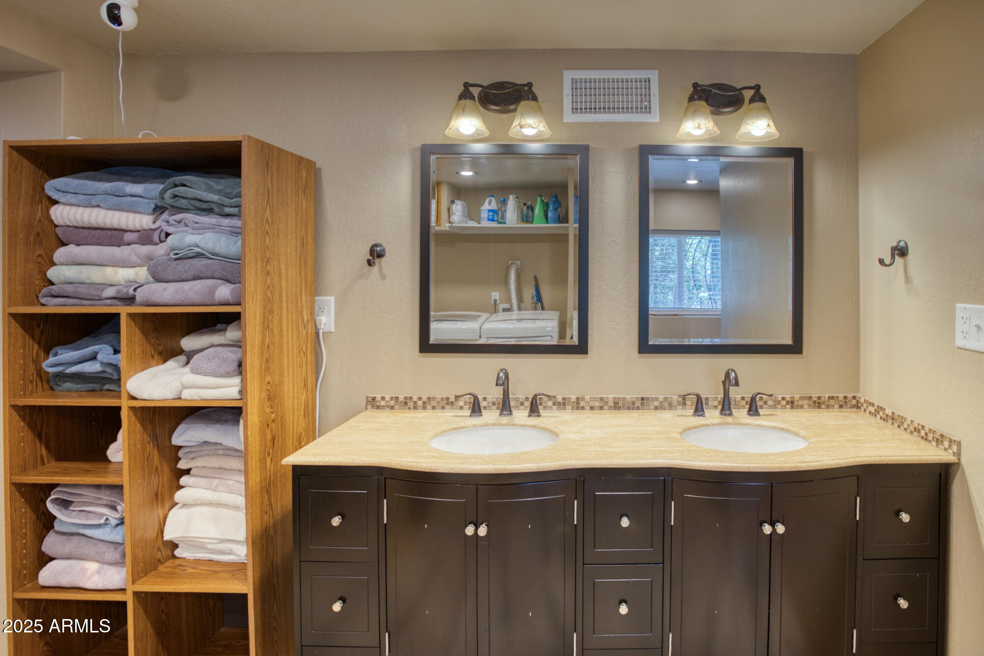 2611 Ellsworth Avenue Show Low, AZ 85901 - Photo 23 of 41 a bathroom with a sink and a mirror