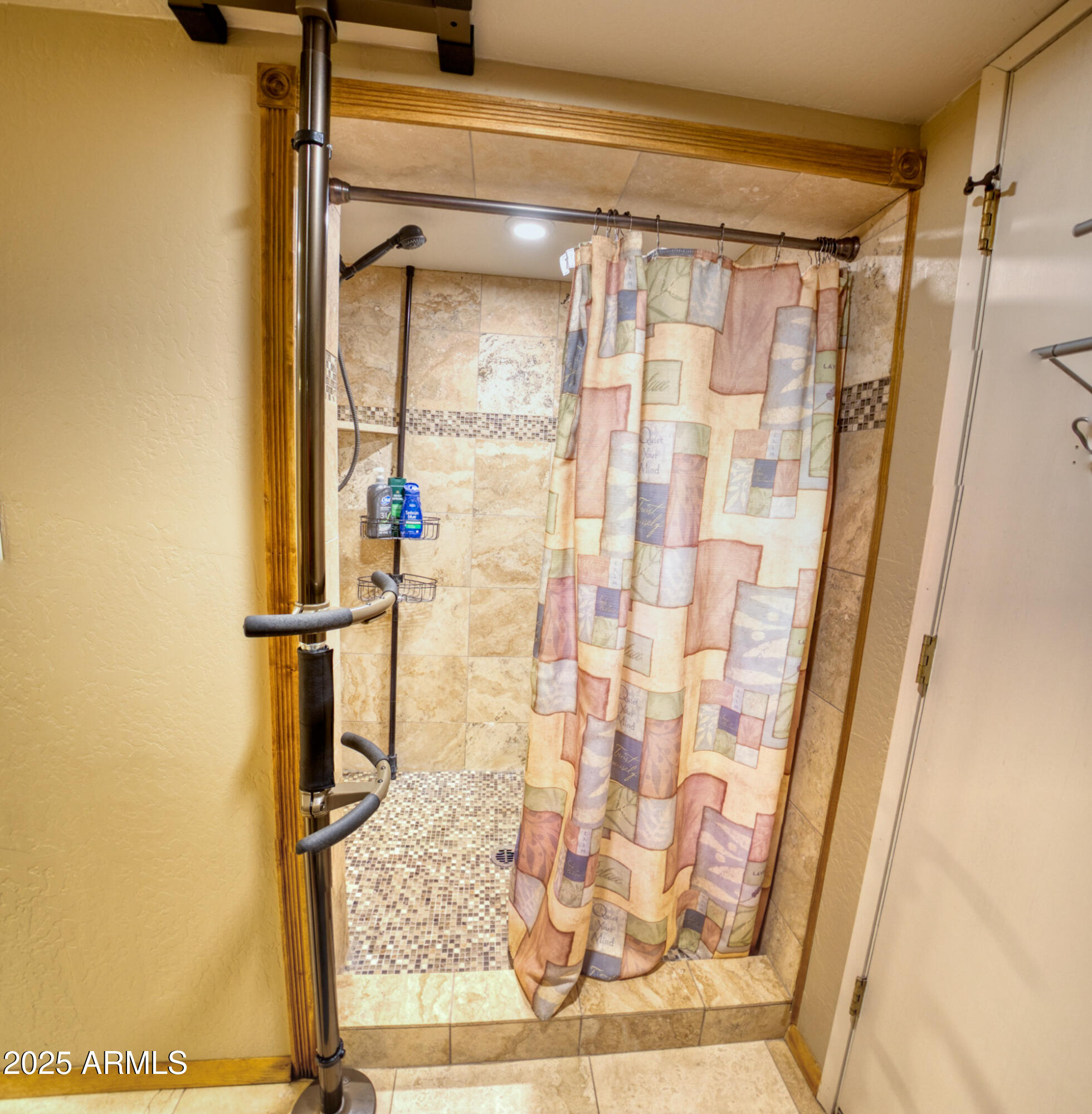 2611 Ellsworth Avenue Show Low, AZ 85901 - Photo 24 of 41 a bathroom with a shower and a glass door