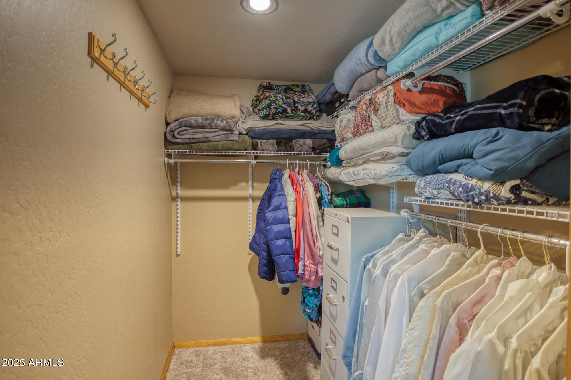 2611 Ellsworth Avenue Show Low, AZ 85901 - Photo 25 of 41 a view of walk in closet with clothes and shoes