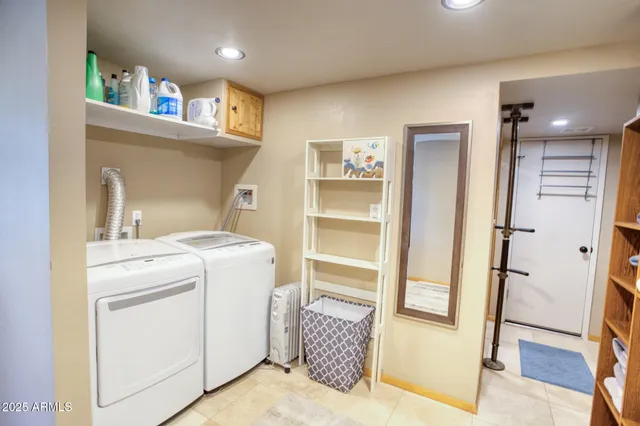 a bathroom with a shower and a glass door