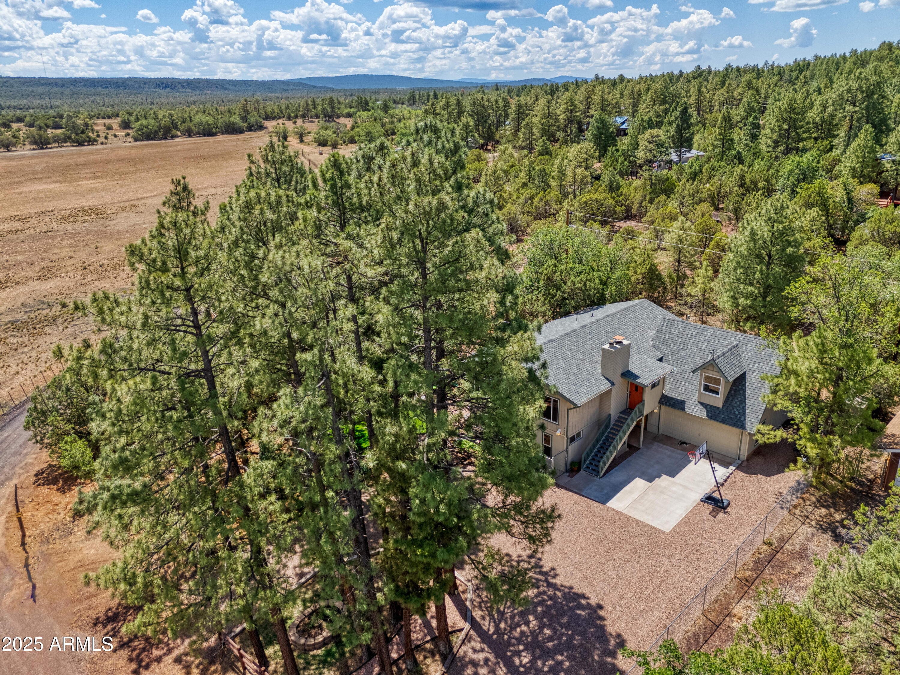 2611 Ellsworth Avenue Show Low, AZ 85901 - Photo 27 of 41 an aerial view of a house with a yard