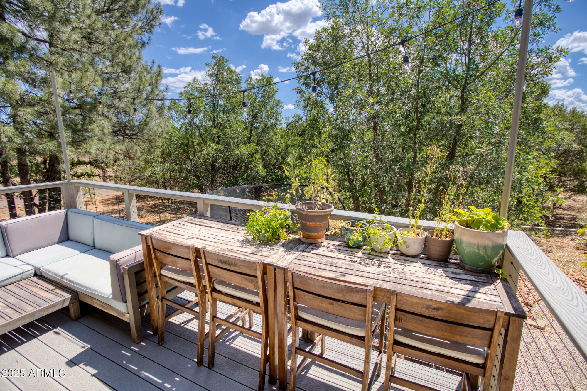 2611 Ellsworth Avenue Show Low, AZ 85901 - Photo 36 of 41 a view of a patio with couches chairs and wooden floor