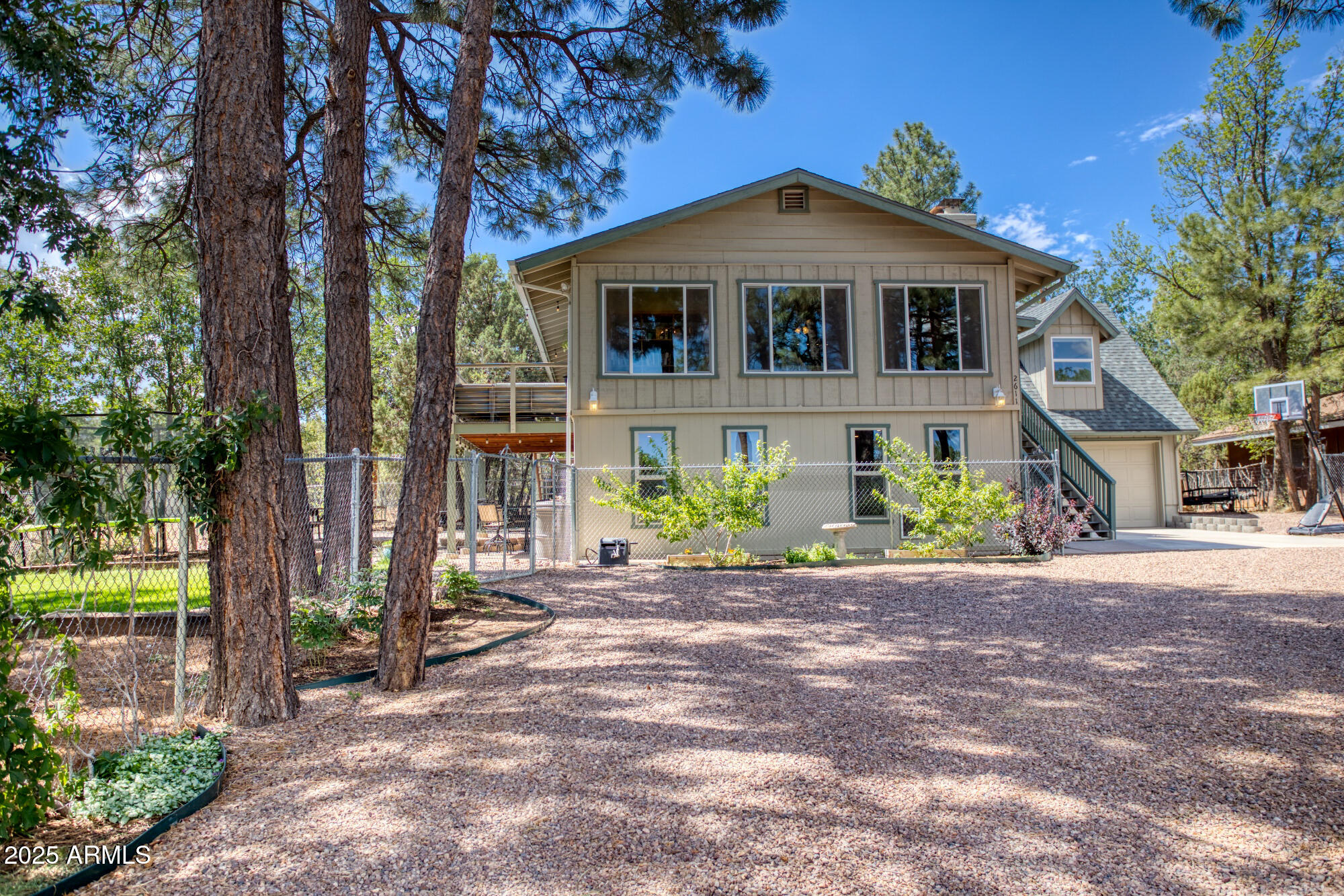2611 Ellsworth Avenue Show Low, AZ 85901 - Photo 37 of 41 a front view of a house with a garden