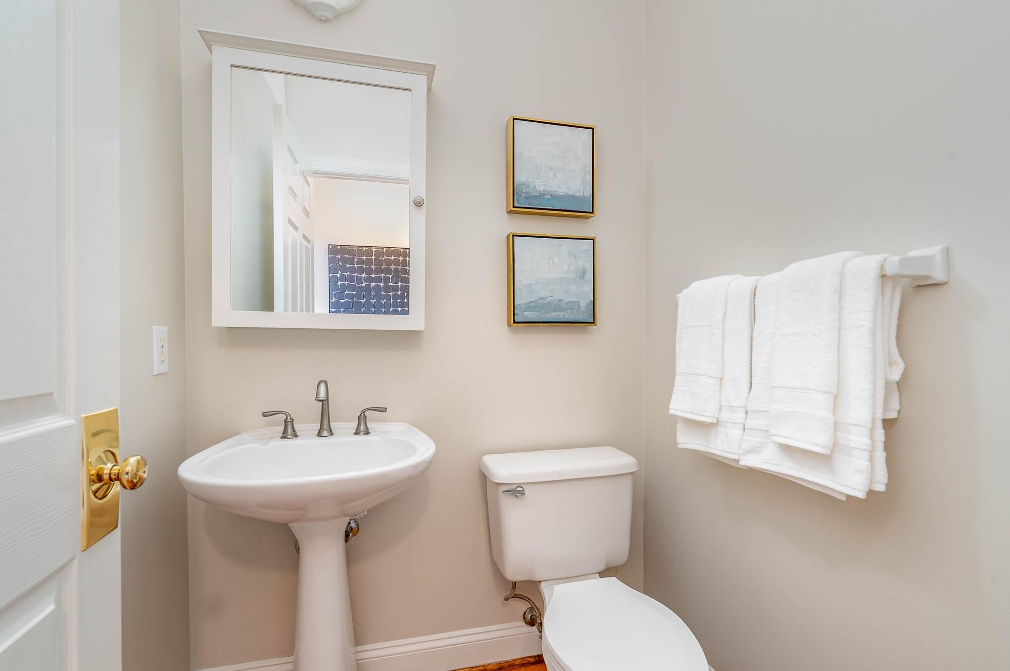 3924 Highview Road Charlotte, NC 28210 - Photo 19 of 45 a bathroom with a toilet sink and mirror