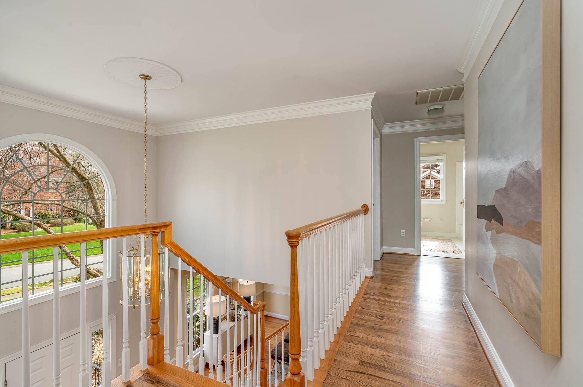 3924 Highview Road Charlotte, NC 28210 - Photo 20 of 45 a view of a hallway with wooden floor and staircase