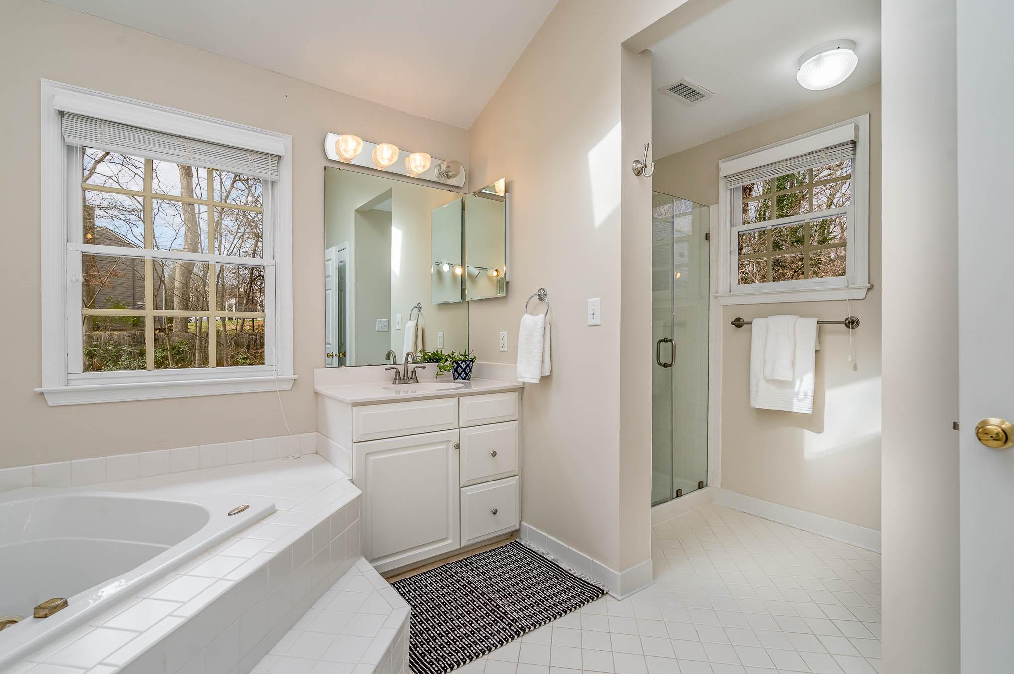 3924 Highview Road Charlotte, NC 28210 - Photo 24 of 45 a bathroom with a tub sink toilet and window