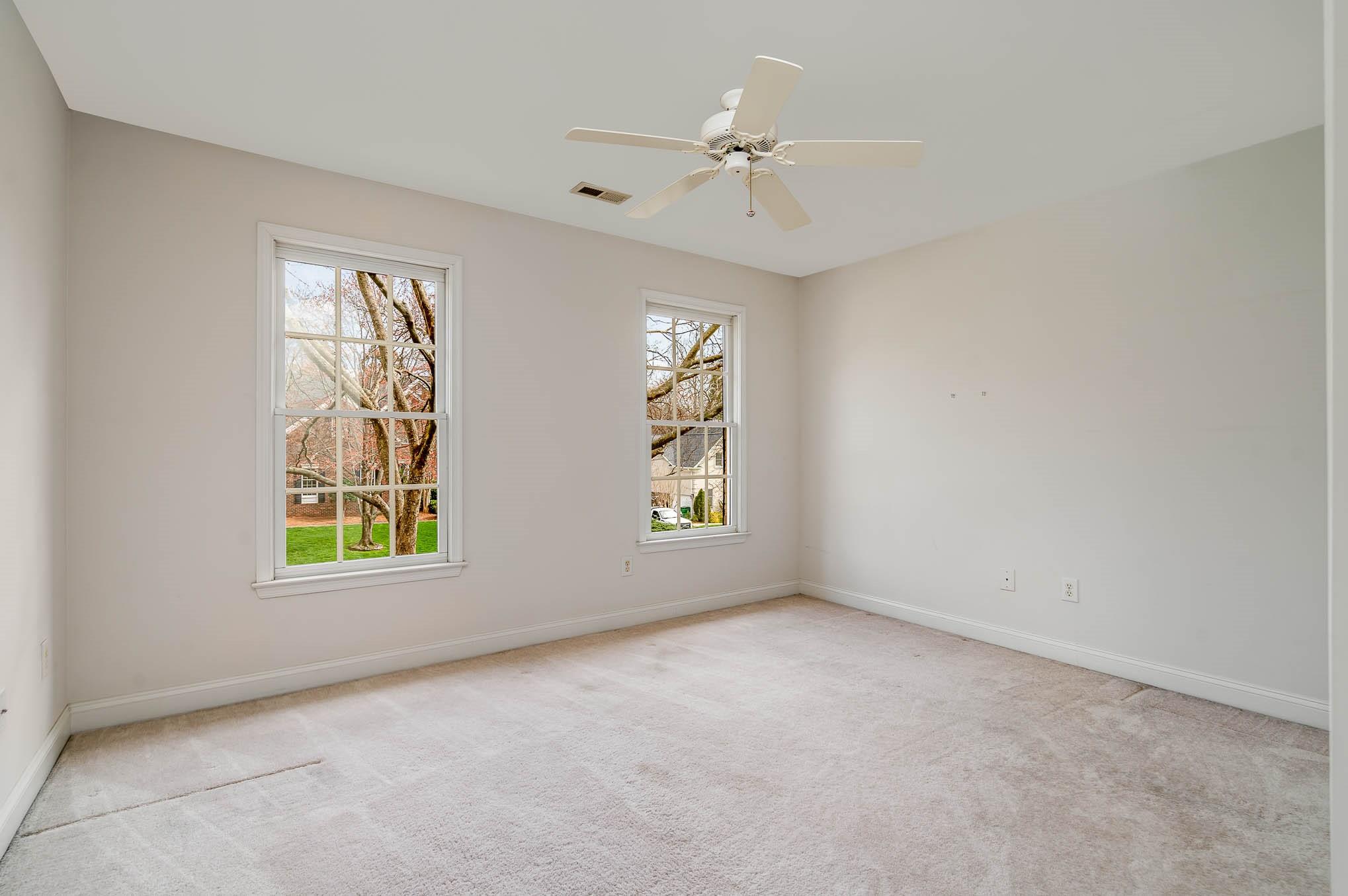 3924 Highview Road Charlotte, NC 28210 - Photo 25 of 45 an empty room with windows and fan