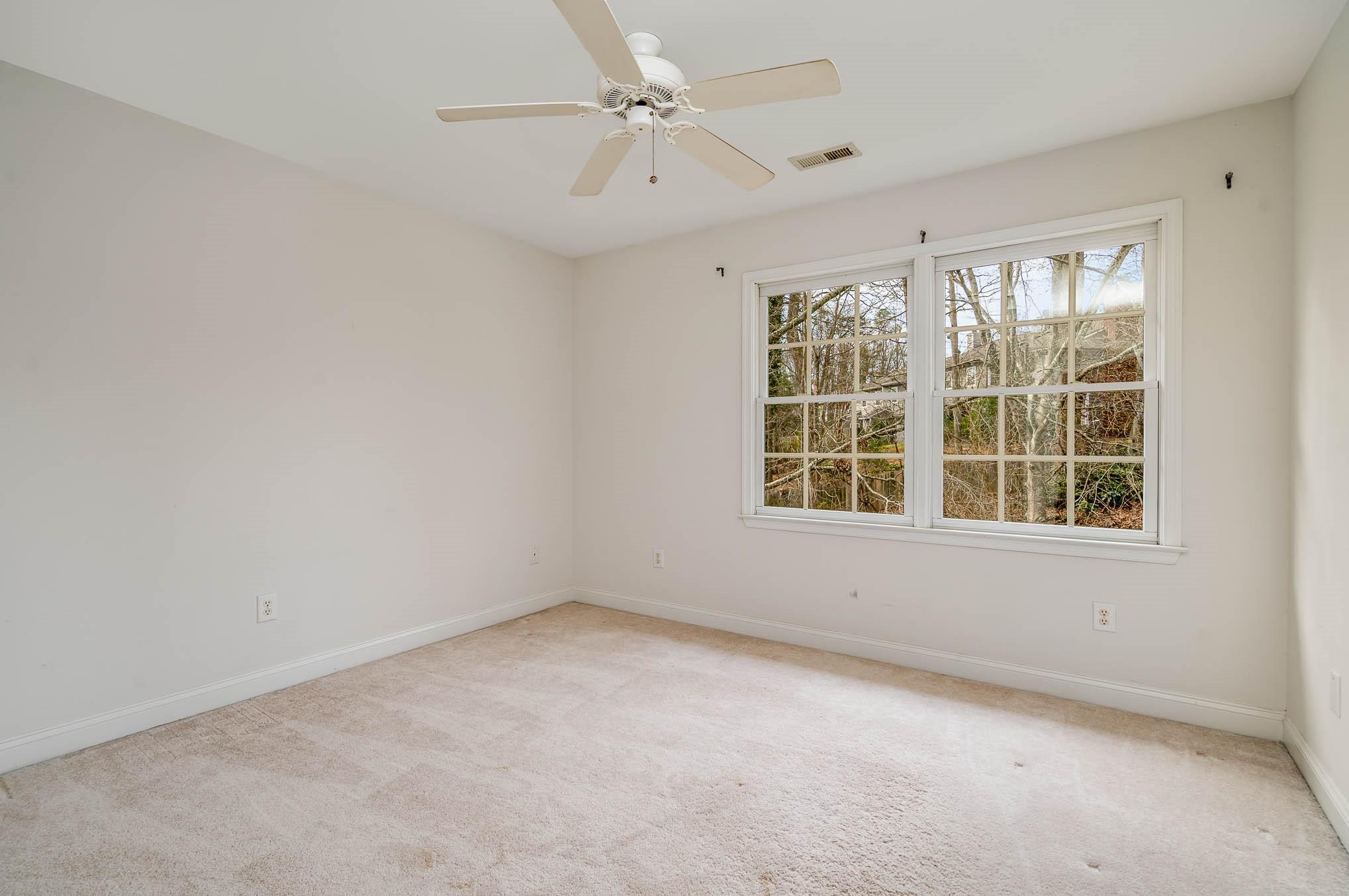 3924 Highview Road Charlotte, NC 28210 - Photo 27 of 45 an empty room with a window and a fan