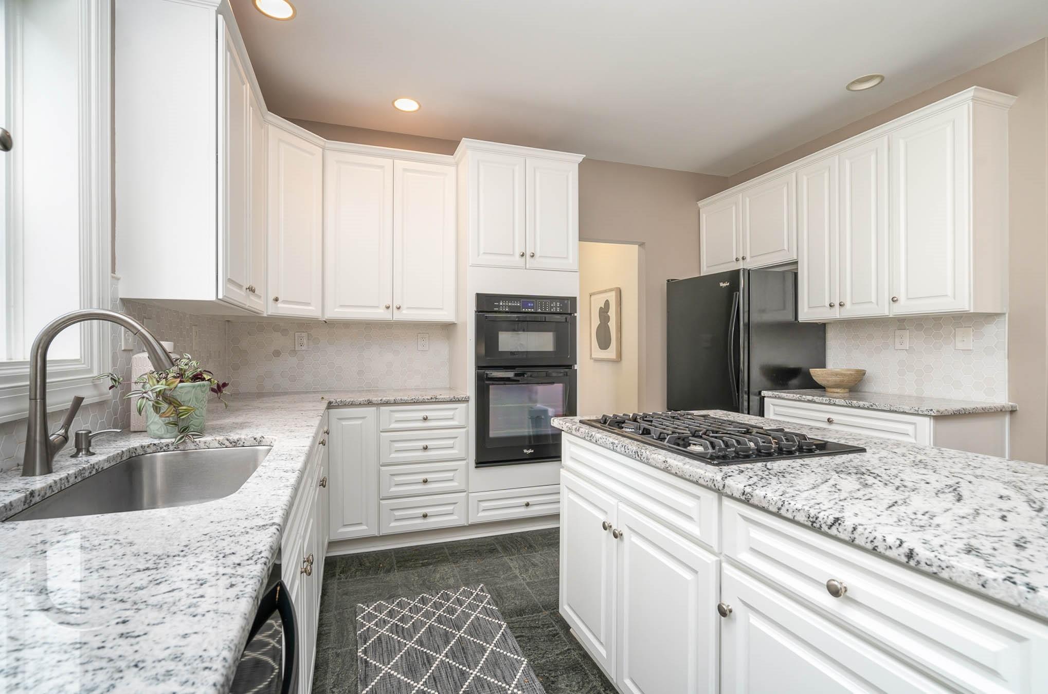 3924 Highview Road Charlotte, NC 28210 - Photo 8 of 45 a kitchen with granite countertop a sink stove and refrigerator