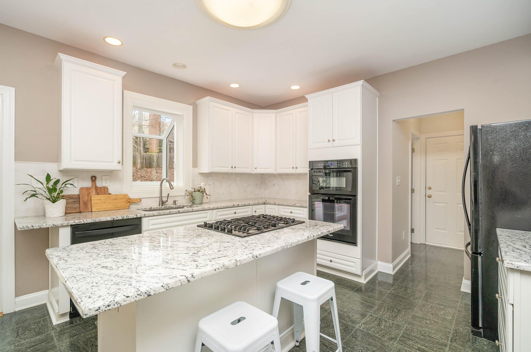 3924 Highview Road Charlotte, NC 28210 - Photo 10 of 45 a kitchen with granite countertop a sink stove and refrigerator