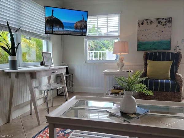 a view of a living room and a potted plant