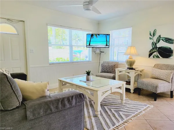 a living room with furniture and a table