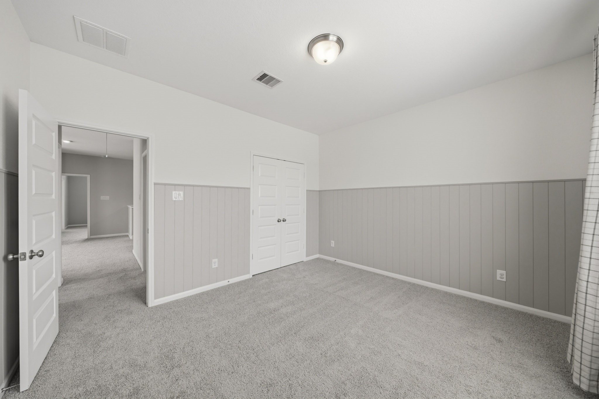 4103 Tranquil Square Road Houston, TX 77043 - Photo 32 of 39 Elegant double doors open to a spacious closet designed for effortless organization and everyday convenience.