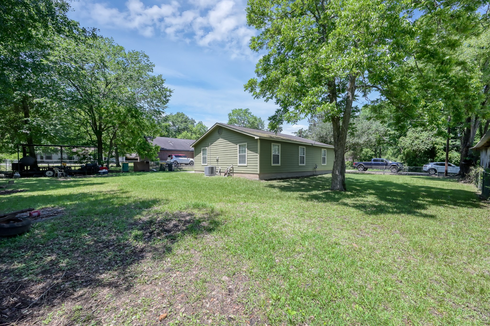 805 Webb Street Conroe, TX 77301 - Photo 17 of 19 a front view of house with yard and green space