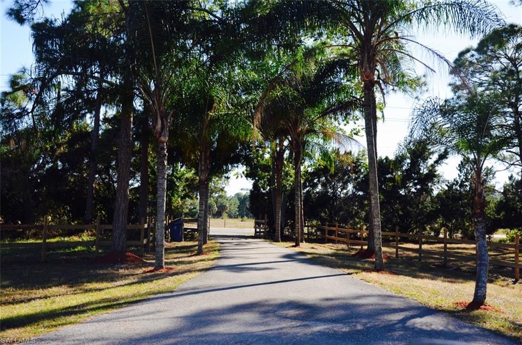 17981 North River Road Alva, FL 33920 - Photo 1 of 25 a view of a fountain with tree s