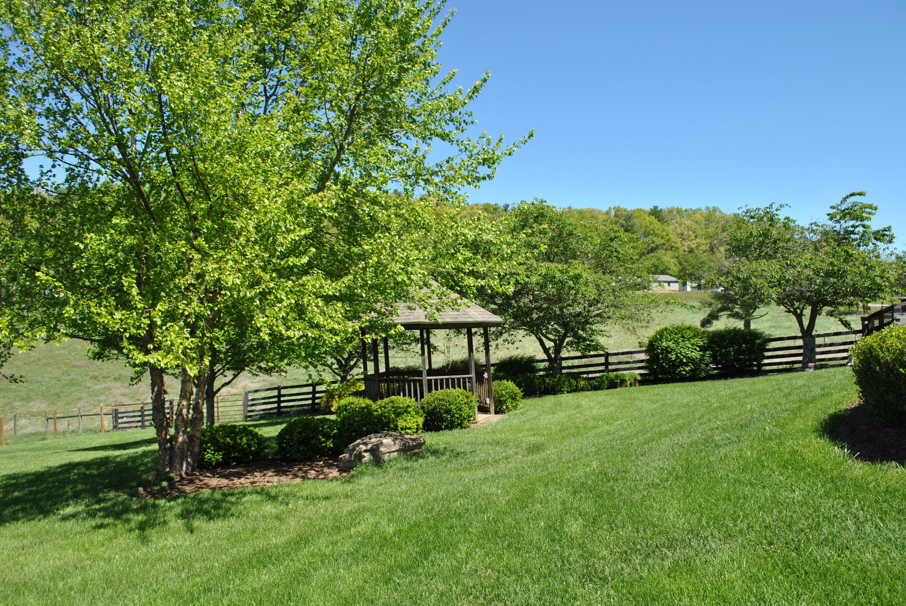 1330 Huffville Road Northeast Pilot, VA 24138 - Photo 23 of 100 a view of a backyard with a garden