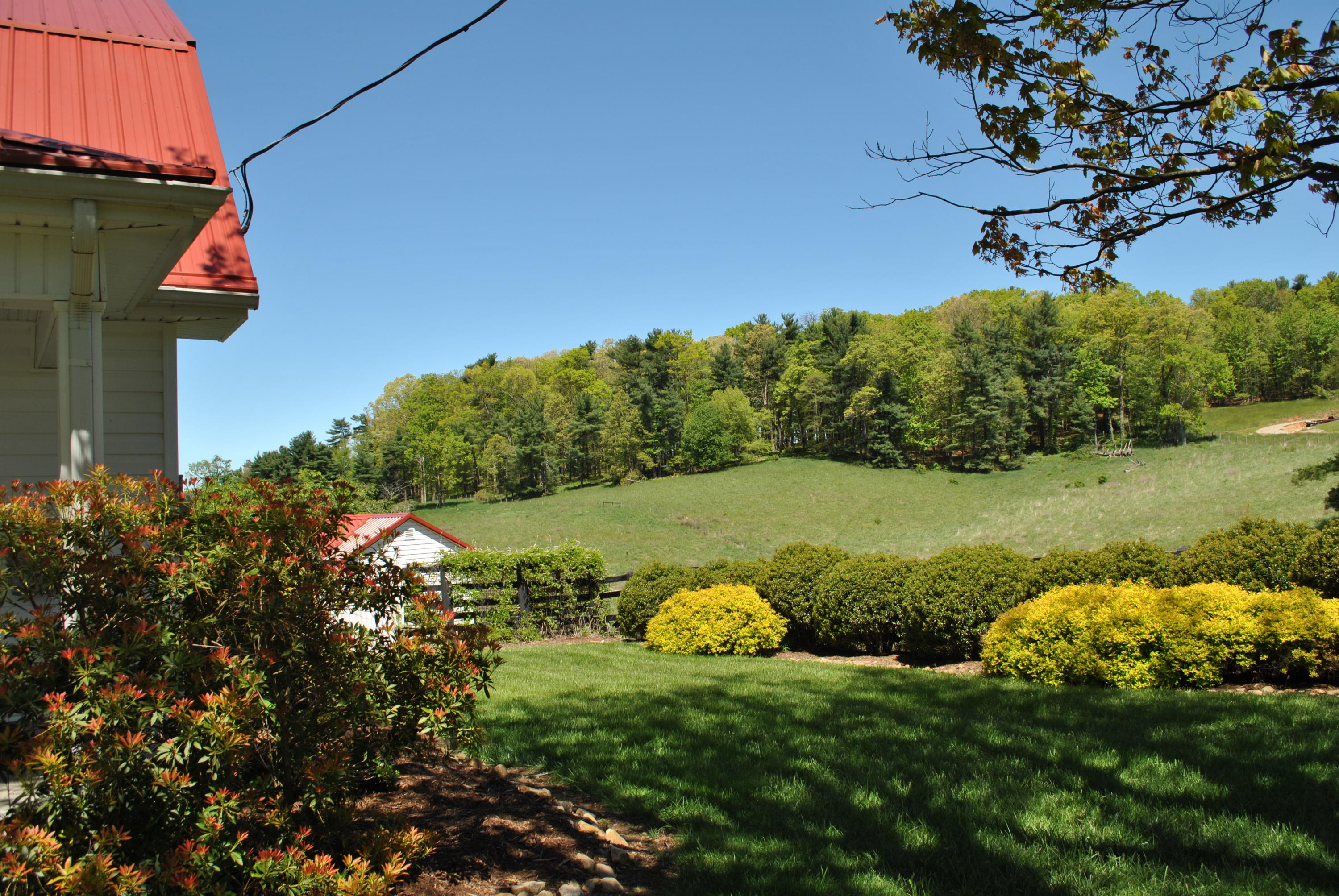 1330 Huffville Road Northeast Pilot, VA 24138 - Photo 4 of 100 a view of a lake with a house in the background