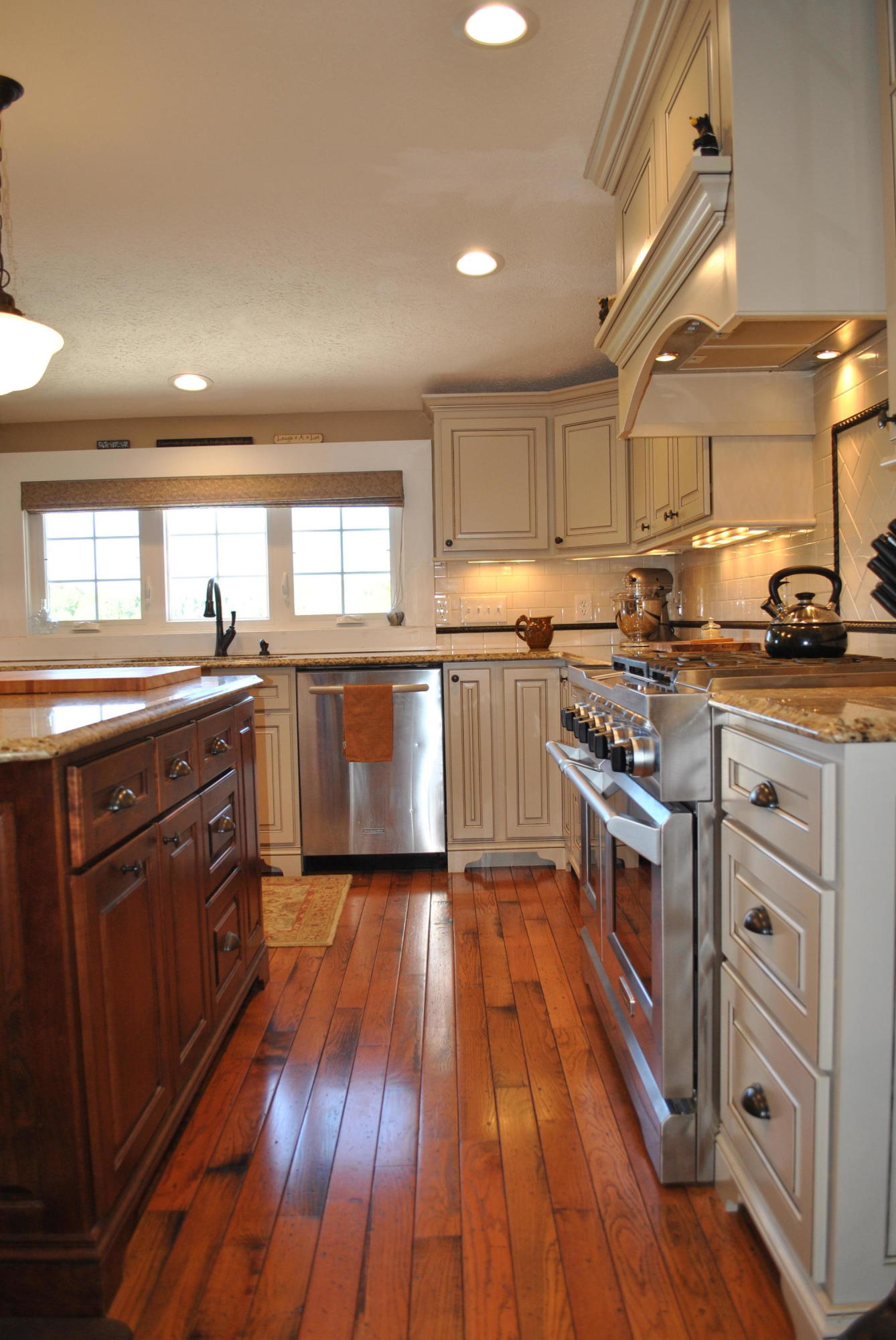 1330 Huffville Road Northeast Pilot, VA 24138 - Photo 37 of 100 a kitchen with stainless steel appliances granite countertop wooden floors and white cabinets