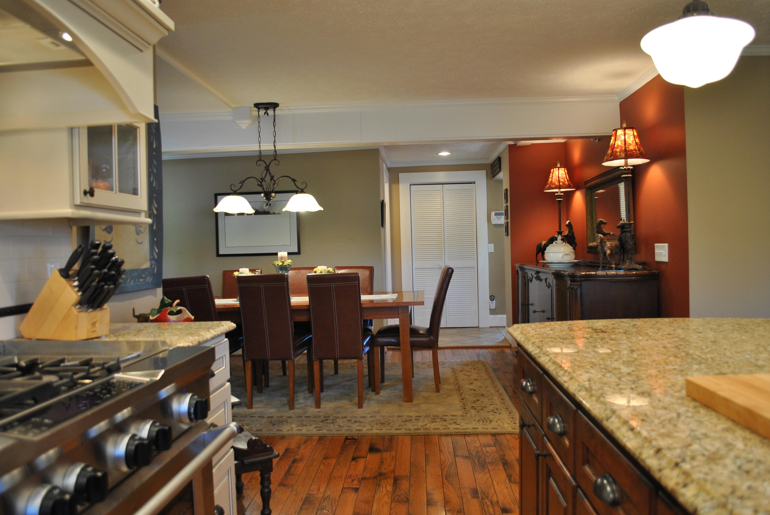 1330 Huffville Road Northeast Pilot, VA 24138 - Photo 44 of 100 a view of a dining room and livingroom with furniture wooden floor a chandelier