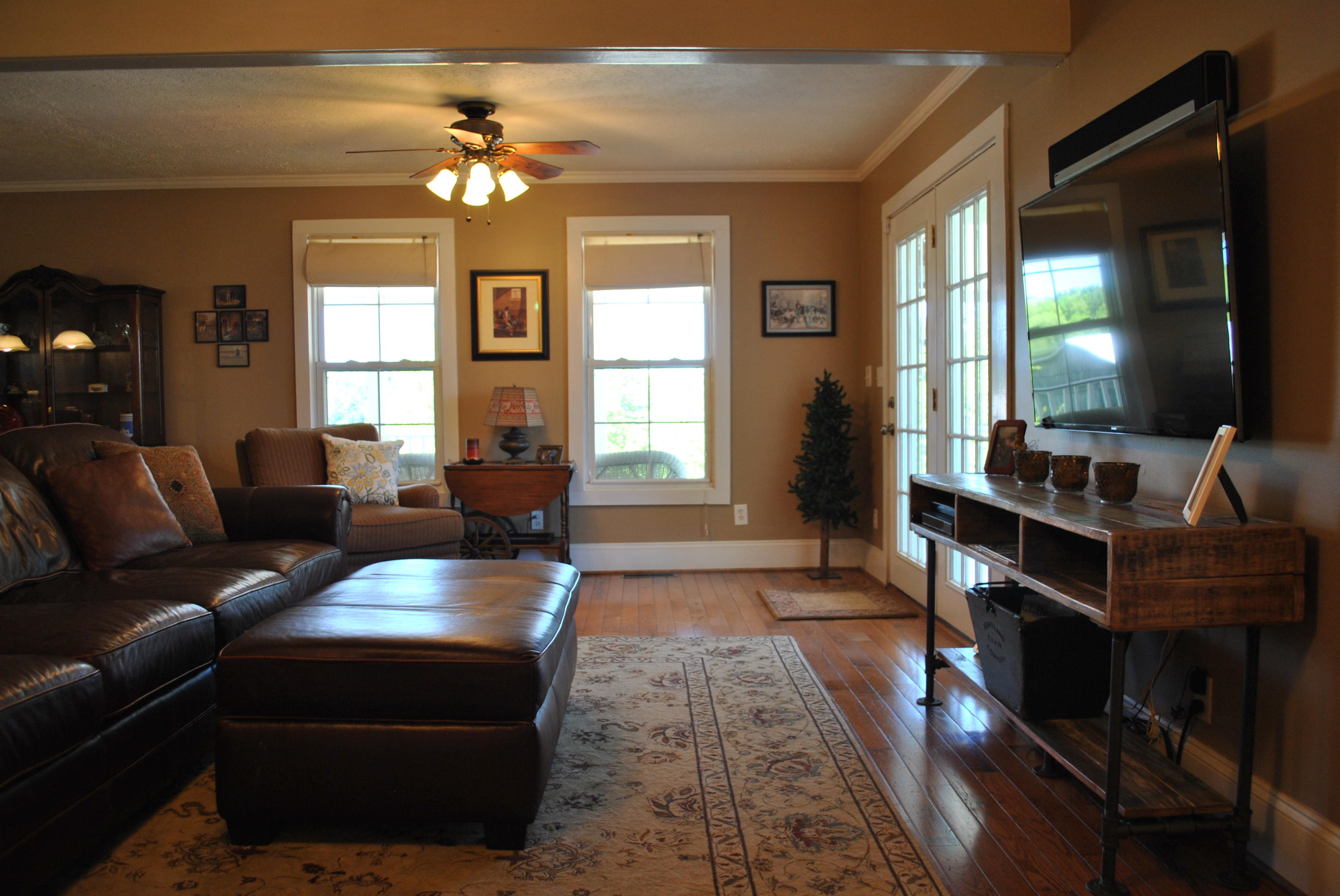 1330 Huffville Road Northeast Pilot, VA 24138 - Photo 52 of 100 a living room with furniture a chandelier and a large window