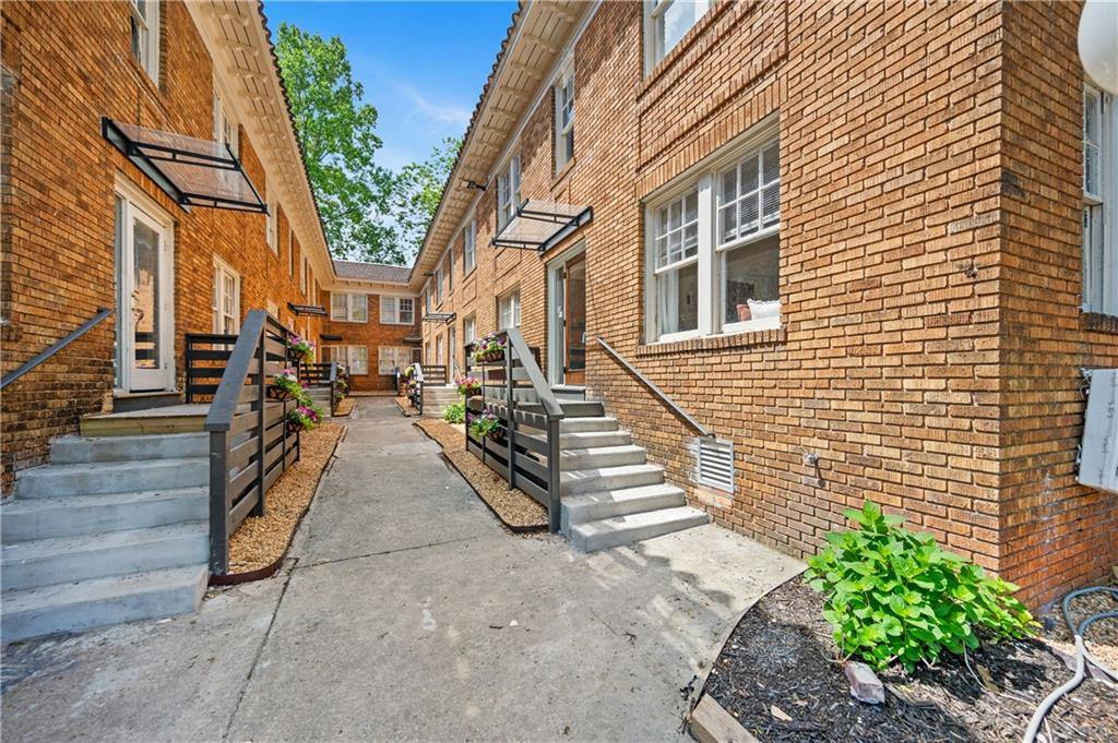 405 4th Street Northeast, Unit 8 Atlanta, GA 30308 - Photo 11 of 12 a view of a pathway with a house