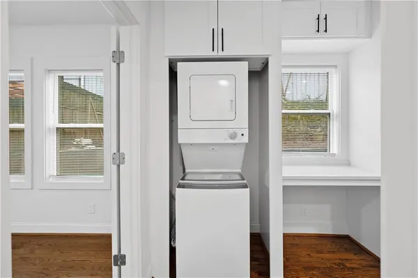 a view of an entryway with wooden floor