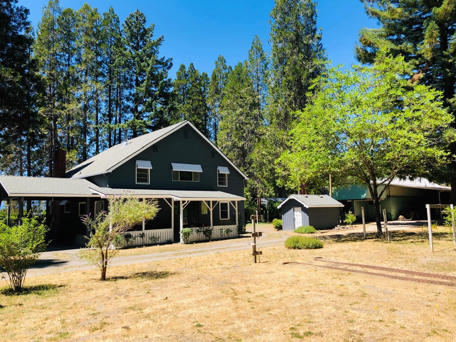 2368 Upper River Road Grants Pass, OR 97526 - Photo 13 of 30 a swimming pool with some trees in the background