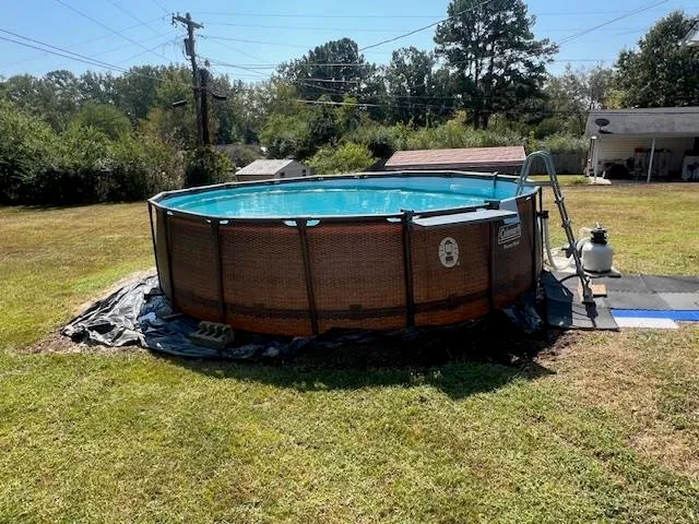 a view of a backyard with a tub