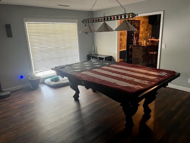 a room with musical instruments and wooden floor