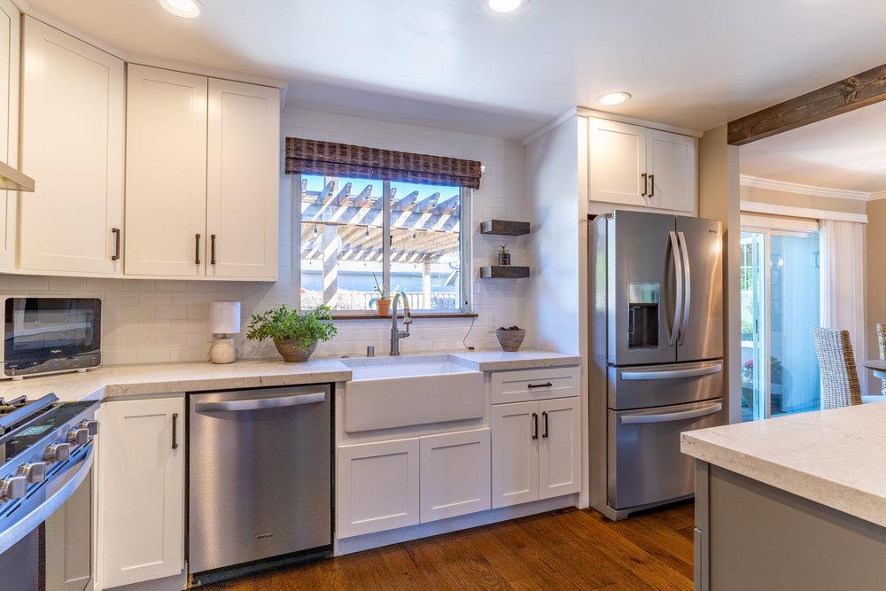 14832 Acton Drive San Jose, CA 95124 - Photo 11 of 47 a kitchen with a refrigerator sink and cabinets