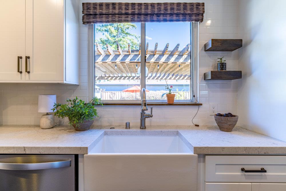 14832 Acton Drive San Jose, CA 95124 - Photo 13 of 47 a kitchen with a sink and a potted plant