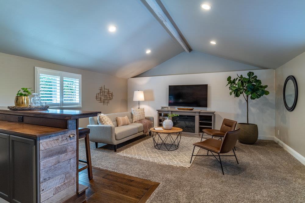 14832 Acton Drive San Jose, CA 95124 - Photo 20 of 47 a living room with furniture and a flat screen tv