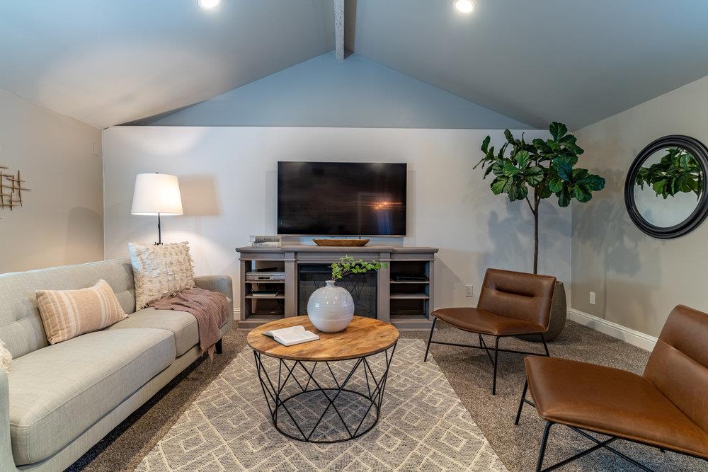 14832 Acton Drive San Jose, CA 95124 - Photo 21 of 47 a living room with furniture and a flat screen tv