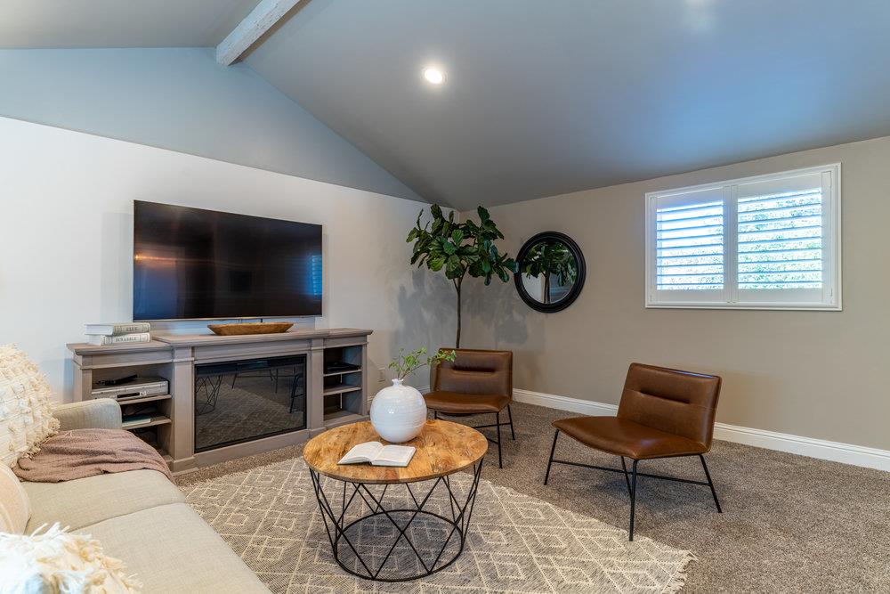 14832 Acton Drive San Jose, CA 95124 - Photo 22 of 47 a living room with furniture and a flat screen tv