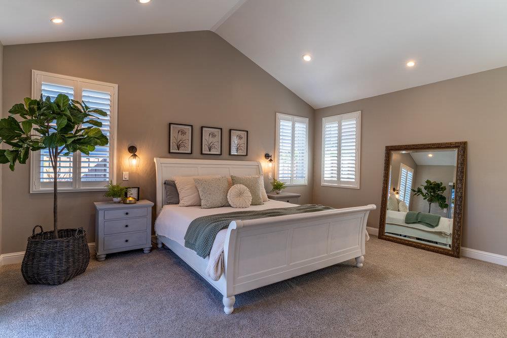 14832 Acton Drive San Jose, CA 95124 - Photo 29 of 47 a bedroom with a bed and a potted plant