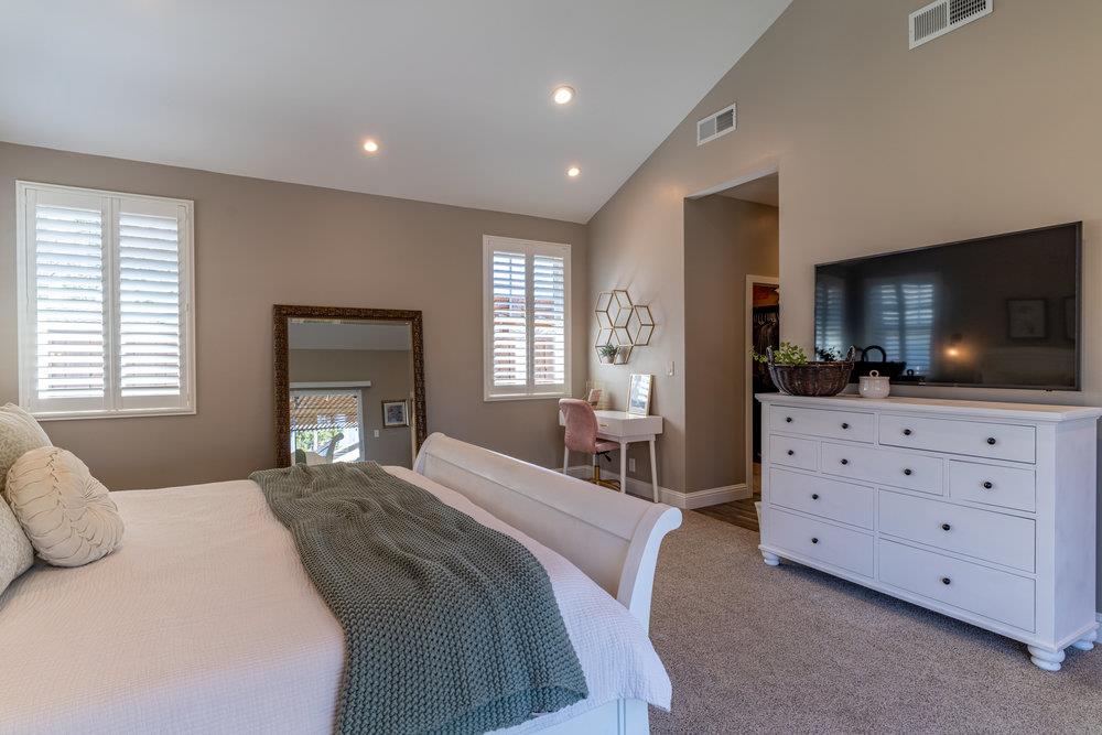 14832 Acton Drive San Jose, CA 95124 - Photo 30 of 47 a bedroom with a bed and a flat screen tv