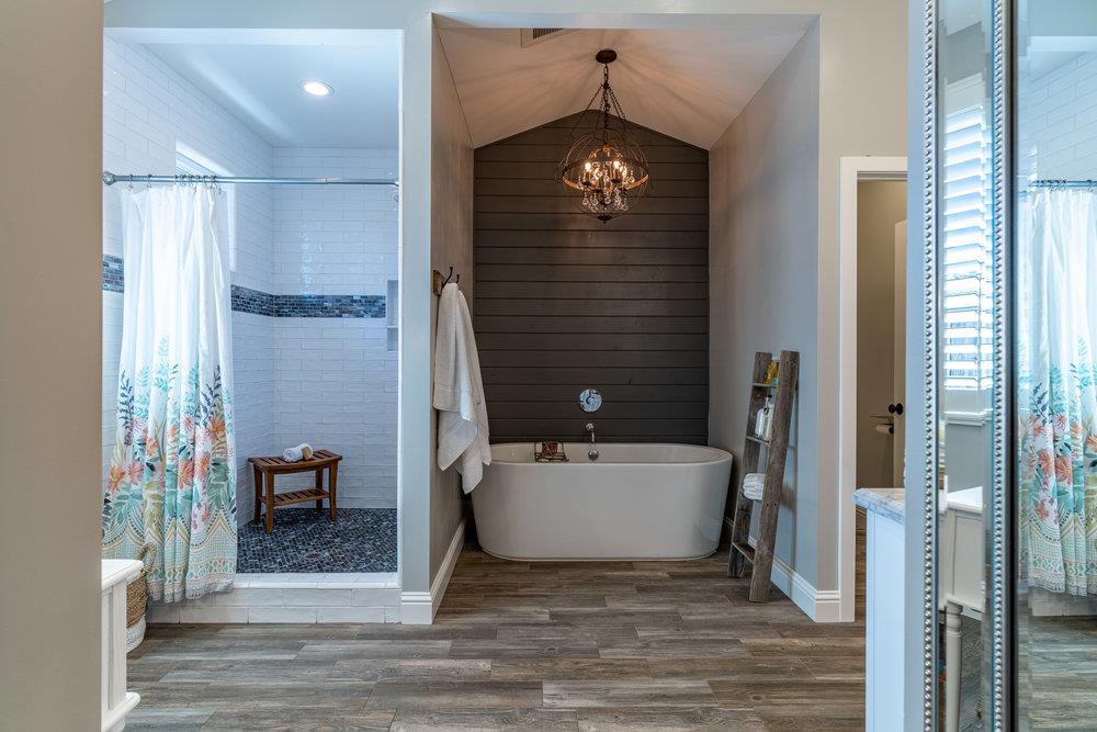 14832 Acton Drive San Jose, CA 95124 - Photo 34 of 47 a bathroom with a sink a mirror and a bathtub
