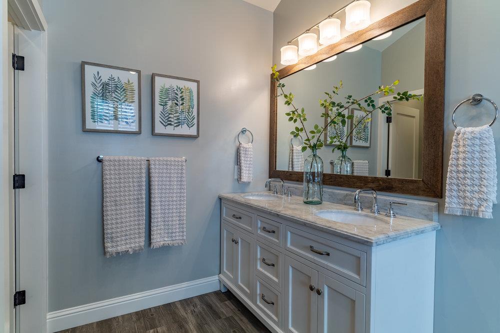14832 Acton Drive San Jose, CA 95124 - Photo 37 of 47 a bathroom with a granite countertop sink and a mirror