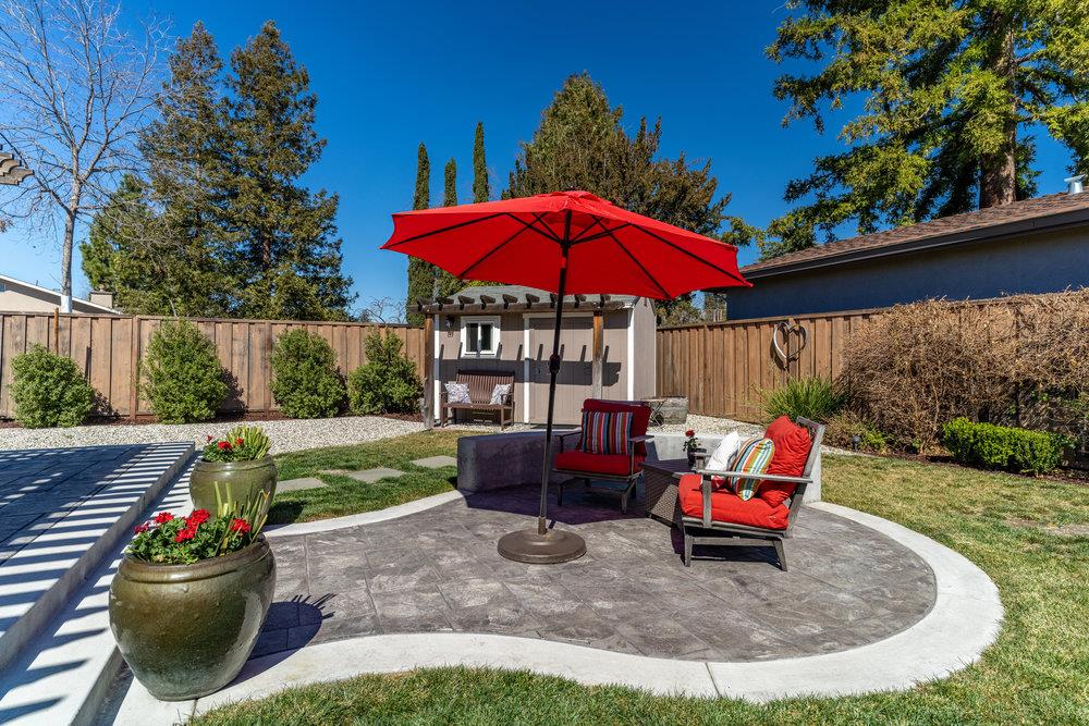 14832 Acton Drive San Jose, CA 95124 - Photo 43 of 47 a view of a wooden chairs and fire pit in the backyard