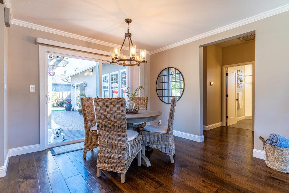 14832 Acton Drive San Jose, CA 95124 - Photo 7 of 47 a view of a dining room with furniture a chandelier and wooden floor