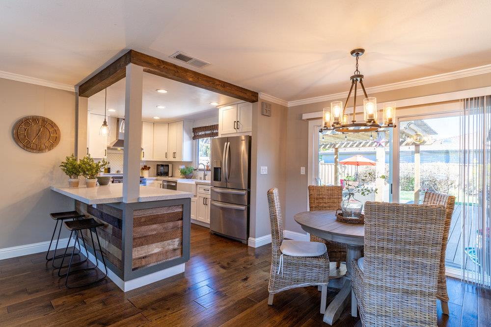 14832 Acton Drive San Jose, CA 95124 - Photo 8 of 47 a dining room with furniture a chandelier and wooden floor