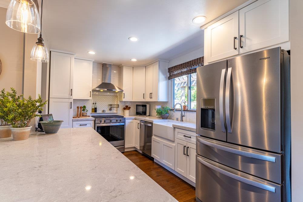 14832 Acton Drive San Jose, CA 95124 - Photo 9 of 47 a kitchen with a refrigerator and a sink