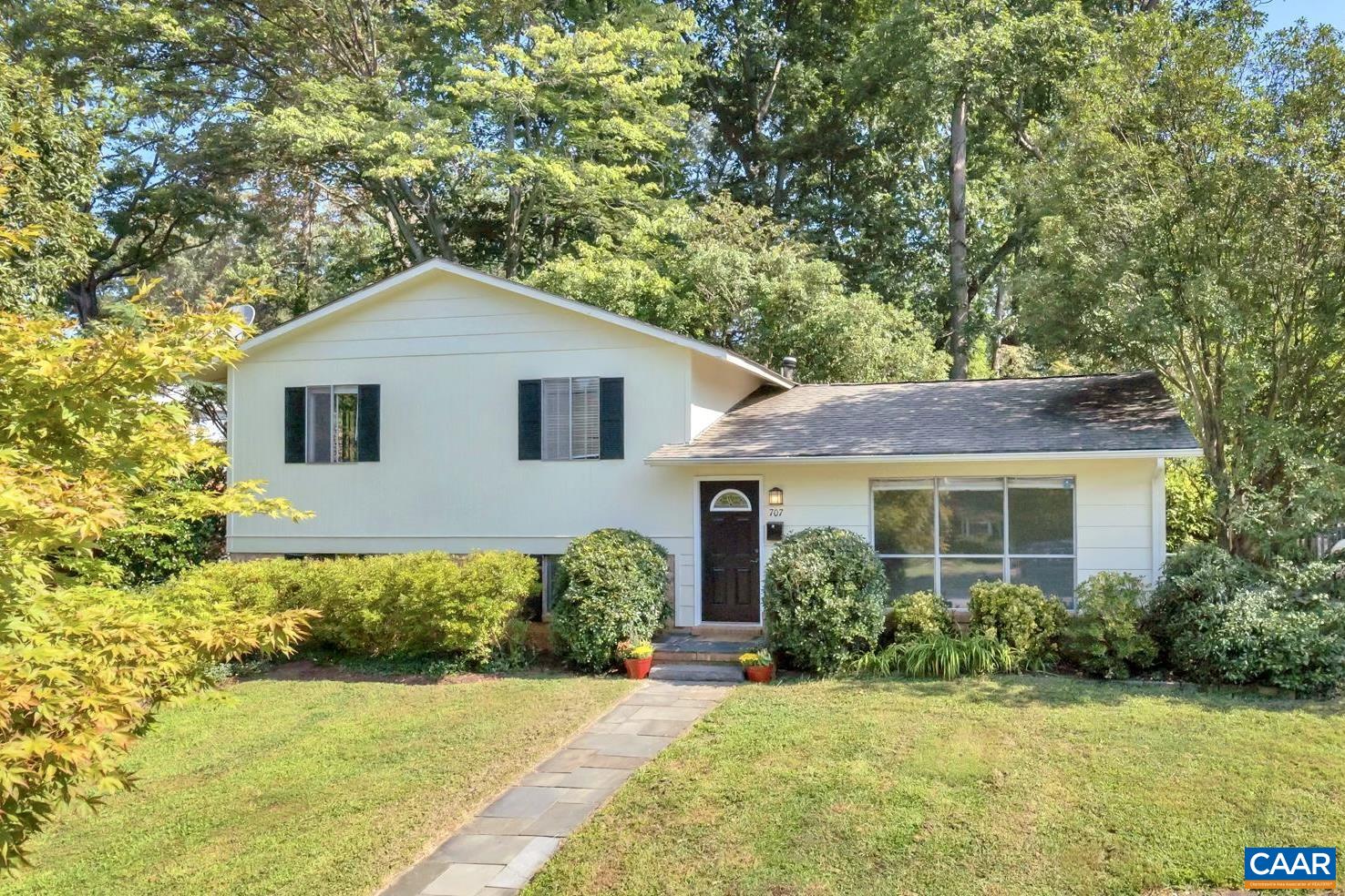 707 Village Road Charlottesville, VA 22903 - Photo 1 of 46 a front view of a house with a yard