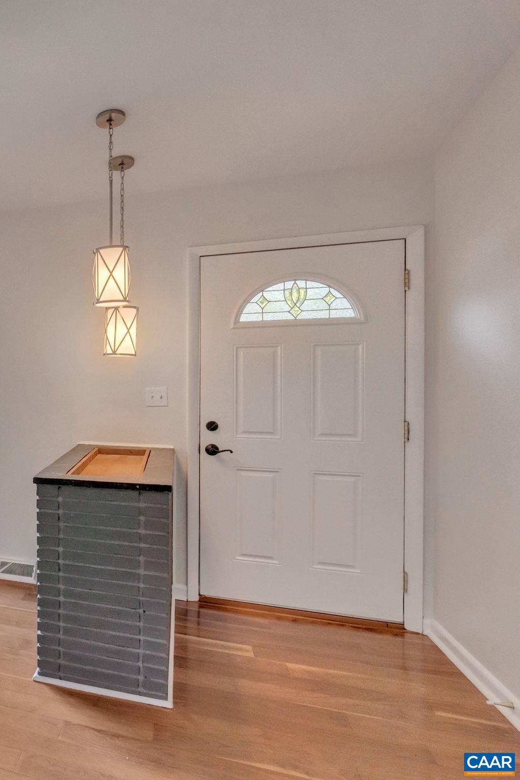 707 Village Road Charlottesville, VA 22903 - Photo 11 of 46 a view of an entryway with wooden floor