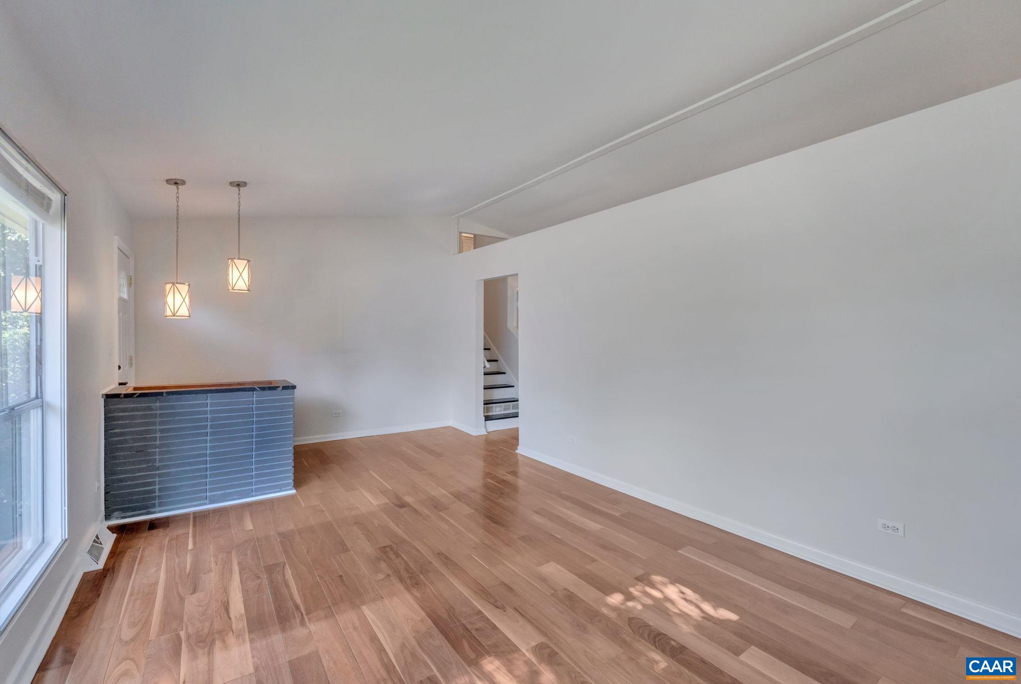 707 Village Road Charlottesville, VA 22903 - Photo 12 of 46 a view of empty room with wooden floor