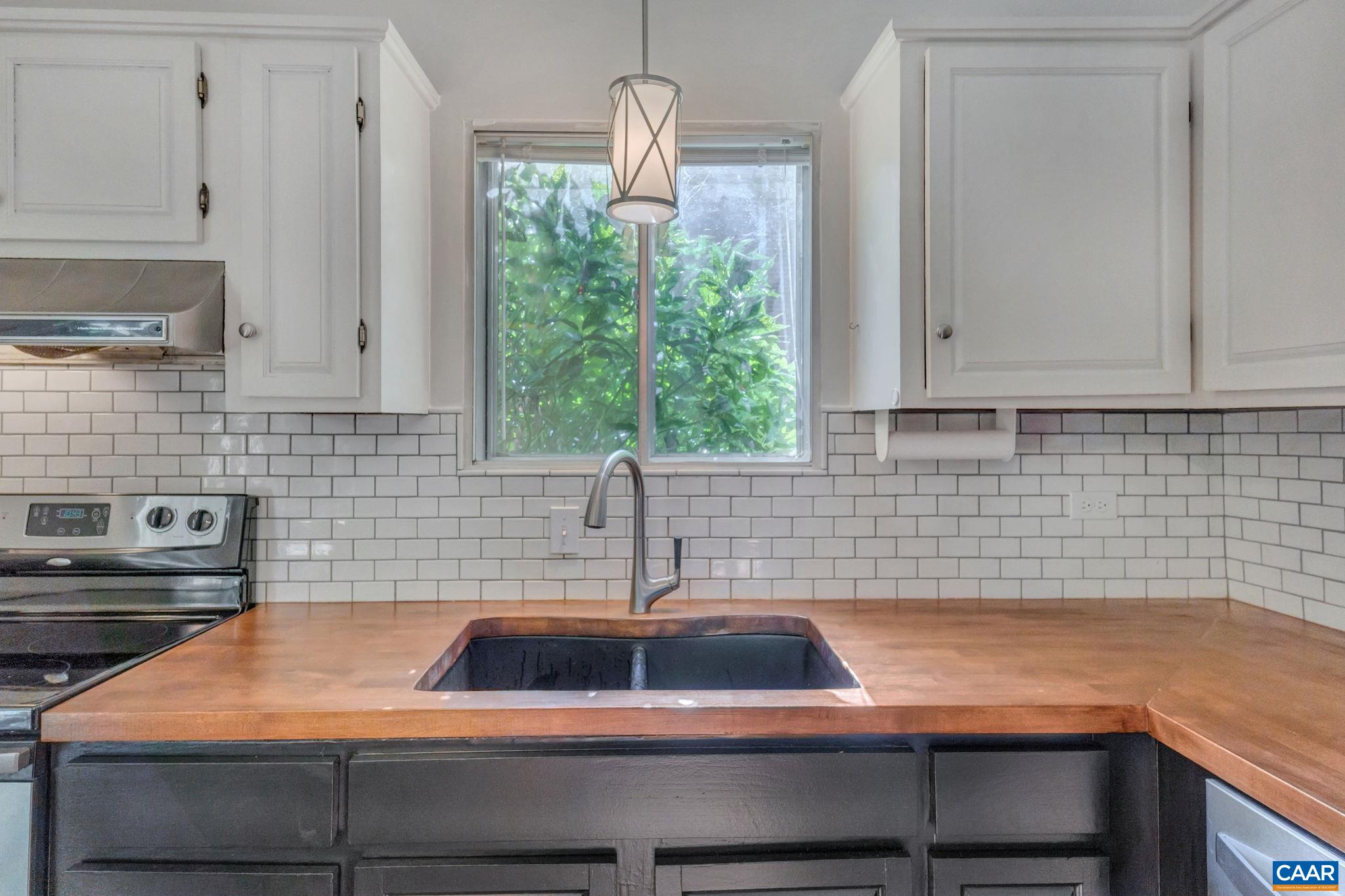 707 Village Road Charlottesville, VA 22903 - Photo 16 of 46 a kitchen with a sink and cabinets