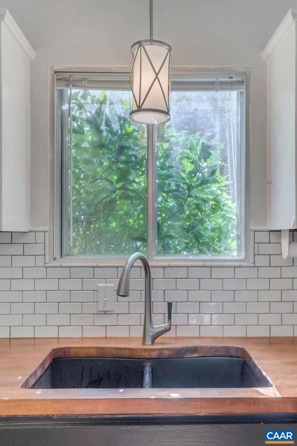 707 Village Road Charlottesville, VA 22903 - Photo 17 of 46 a kitchen with a sink and a window